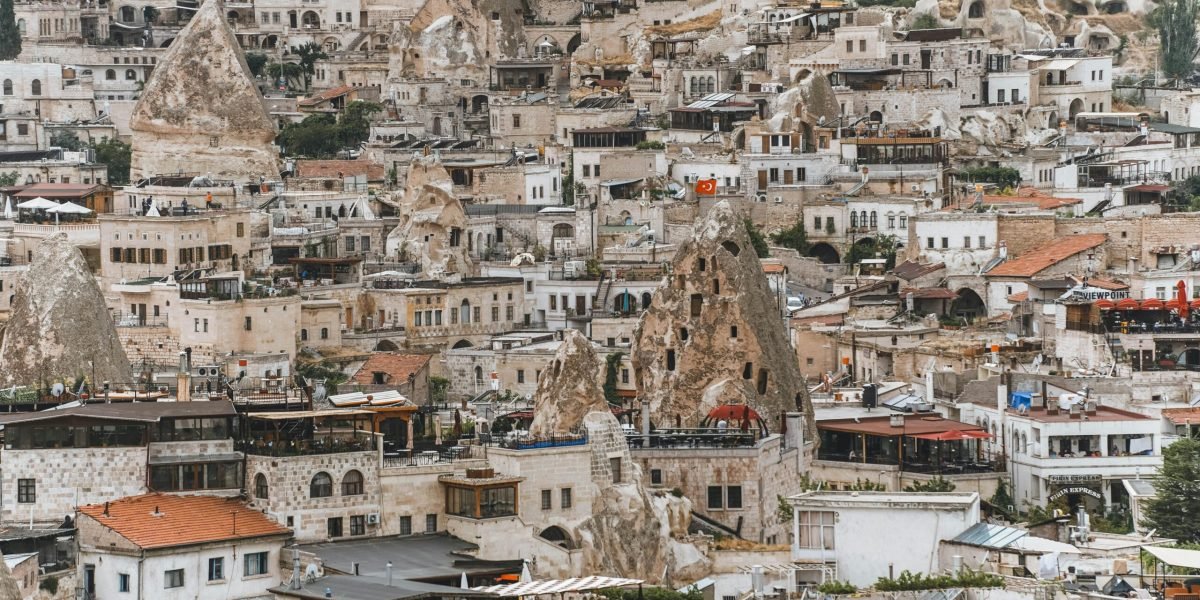 Explore the breathtaking rock formations and ancient dwellings of Cappadocia, Turkey.